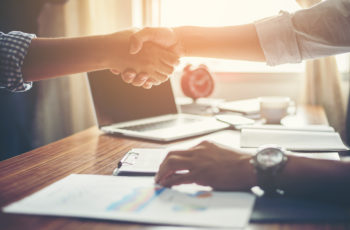 Business People Handshake Greeting Deal at work.